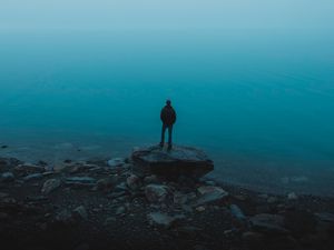 Preview wallpaper man, sea, stones, loneliness, alone