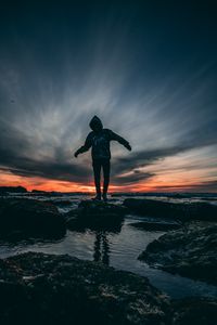 Preview wallpaper man, sea, sunset, stones, loneliness