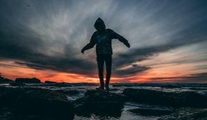 Preview wallpaper man, sea, sunset, stones, loneliness