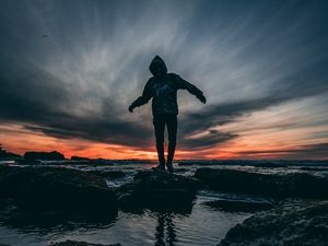 Preview wallpaper man, sea, sunset, stones, loneliness