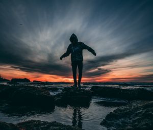 Preview wallpaper man, sea, sunset, stones, loneliness