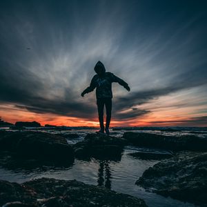 Preview wallpaper man, sea, sunset, stones, loneliness