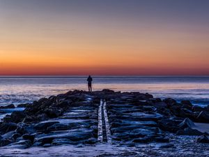 Preview wallpaper man, shore, evening, sea