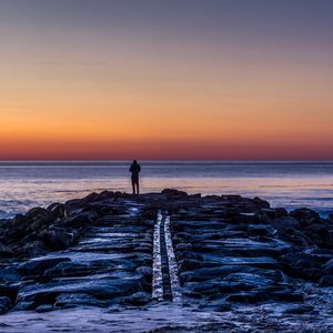 Preview wallpaper man, shore, evening, sea
