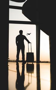 Preview wallpaper man, silhouette, airport, travel, suitcase