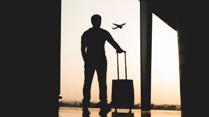 Preview wallpaper man, silhouette, airport, travel, suitcase