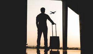 Preview wallpaper man, silhouette, airport, travel, suitcase