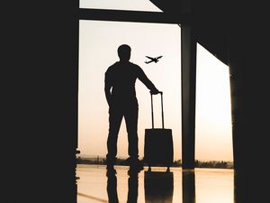 Preview wallpaper man, silhouette, airport, travel, suitcase