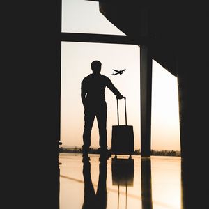 Preview wallpaper man, silhouette, airport, travel, suitcase