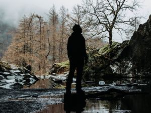 Preview wallpaper man, silhouette, alone, river, nature