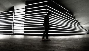 Preview wallpaper man, silhouette, alone, light, architecture, bw