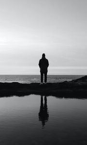 Preview wallpaper man, silhouette, alone, water, black and white, bw