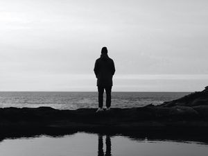 Preview wallpaper man, silhouette, alone, water, black and white, bw