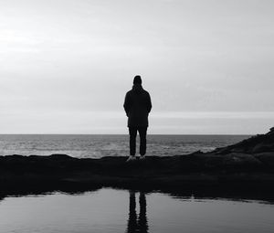 Preview wallpaper man, silhouette, alone, water, black and white, bw