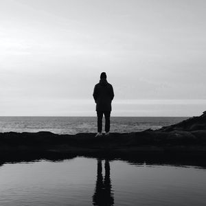 Preview wallpaper man, silhouette, alone, water, black and white, bw
