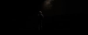 Preview wallpaper man, silhouette, alone, light, ray, dark, black