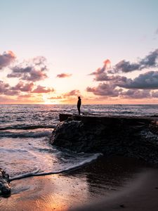 Preview wallpaper man, silhouette, alone, rock, sea, sunset