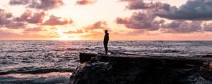 Preview wallpaper man, silhouette, alone, rock, sea, sunset