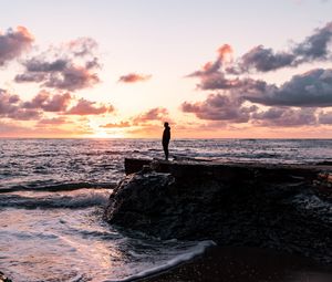 Preview wallpaper man, silhouette, alone, rock, sea, sunset