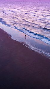 Preview wallpaper man, silhouette, alone, beach, sea, aerial view, purple