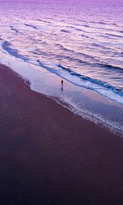 Preview wallpaper man, silhouette, alone, beach, sea, aerial view, purple