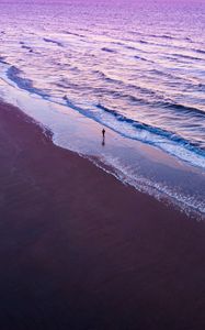 Preview wallpaper man, silhouette, alone, beach, sea, aerial view, purple