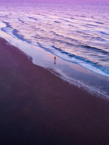 Preview wallpaper man, silhouette, alone, beach, sea, aerial view, purple