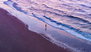 Preview wallpaper man, silhouette, alone, beach, sea, aerial view, purple