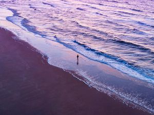 Preview wallpaper man, silhouette, alone, beach, sea, aerial view, purple