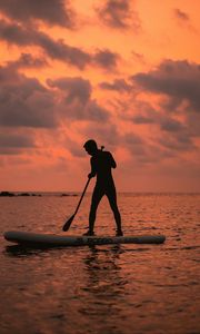 Preview wallpaper man, silhouette, alone, boat, water, sunset, dark