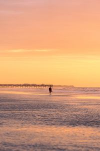 Preview wallpaper man, silhouette, alone, beach, sea, sunset