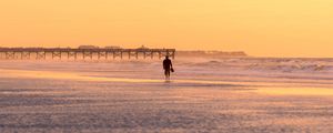 Preview wallpaper man, silhouette, alone, beach, sea, sunset