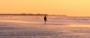 Preview wallpaper man, silhouette, alone, beach, sea, sunset