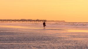 Preview wallpaper man, silhouette, alone, beach, sea, sunset