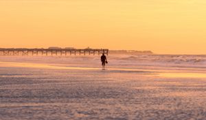 Preview wallpaper man, silhouette, alone, beach, sea, sunset