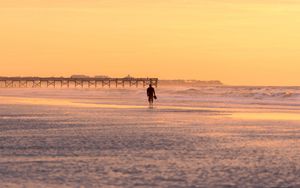 Preview wallpaper man, silhouette, alone, beach, sea, sunset