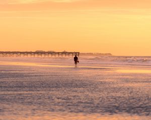 Preview wallpaper man, silhouette, alone, beach, sea, sunset