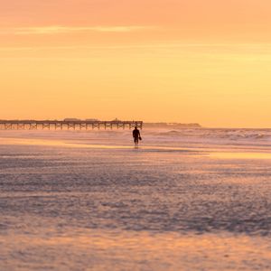 Preview wallpaper man, silhouette, alone, beach, sea, sunset