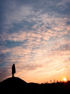 Preview wallpaper man, silhouette, alone, clouds, sunset, dark