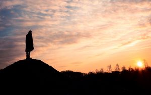 Preview wallpaper man, silhouette, alone, clouds, sunset, dark