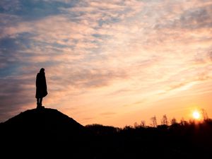 Preview wallpaper man, silhouette, alone, clouds, sunset, dark