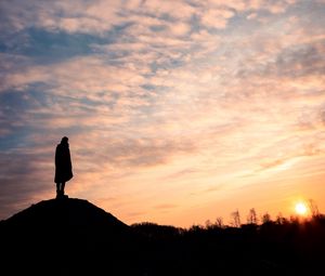 Preview wallpaper man, silhouette, alone, clouds, sunset, dark