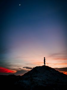 Preview wallpaper man, silhouette, alone, mountain, peak, dusk