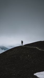 Preview wallpaper man, silhouette, alone, mountains, dusk, nature