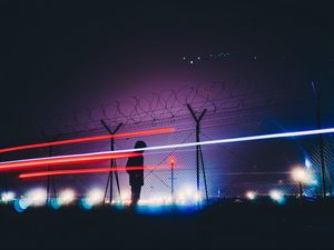 Preview wallpaper man, silhouette, barbed wire, fence