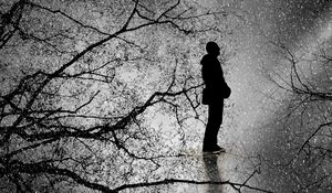 Preview wallpaper man, silhouette, branches, rain, bw