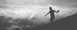 Preview wallpaper man, silhouette, clouds, mountains, bw