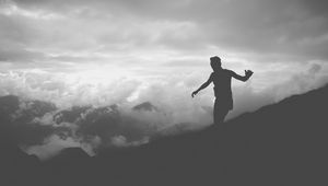 Preview wallpaper man, silhouette, clouds, mountains, bw