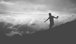 Preview wallpaper man, silhouette, clouds, mountains, bw