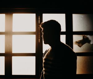 Preview wallpaper man, silhouette, dark, window, light